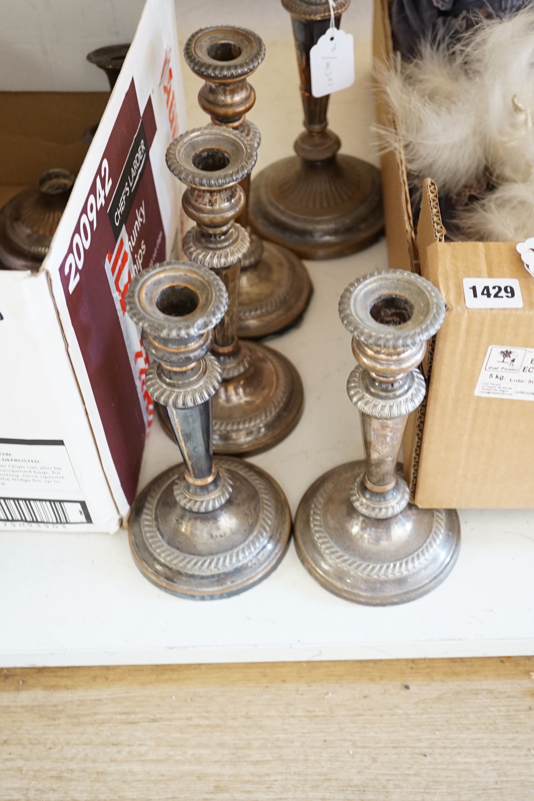 A silver plated three-light candelabrum, set of four similar candlesticks, chamber stick and related parts, candelabrum 40cm high